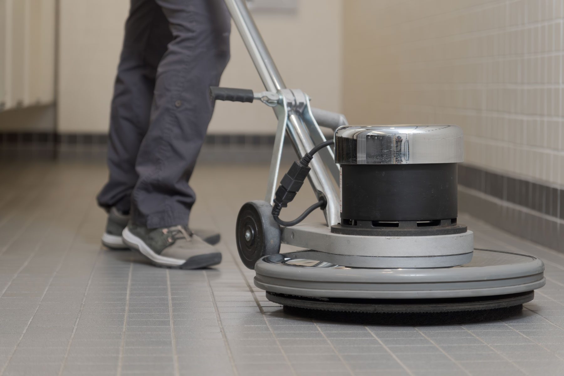 Machine polishing and cleaning a floor